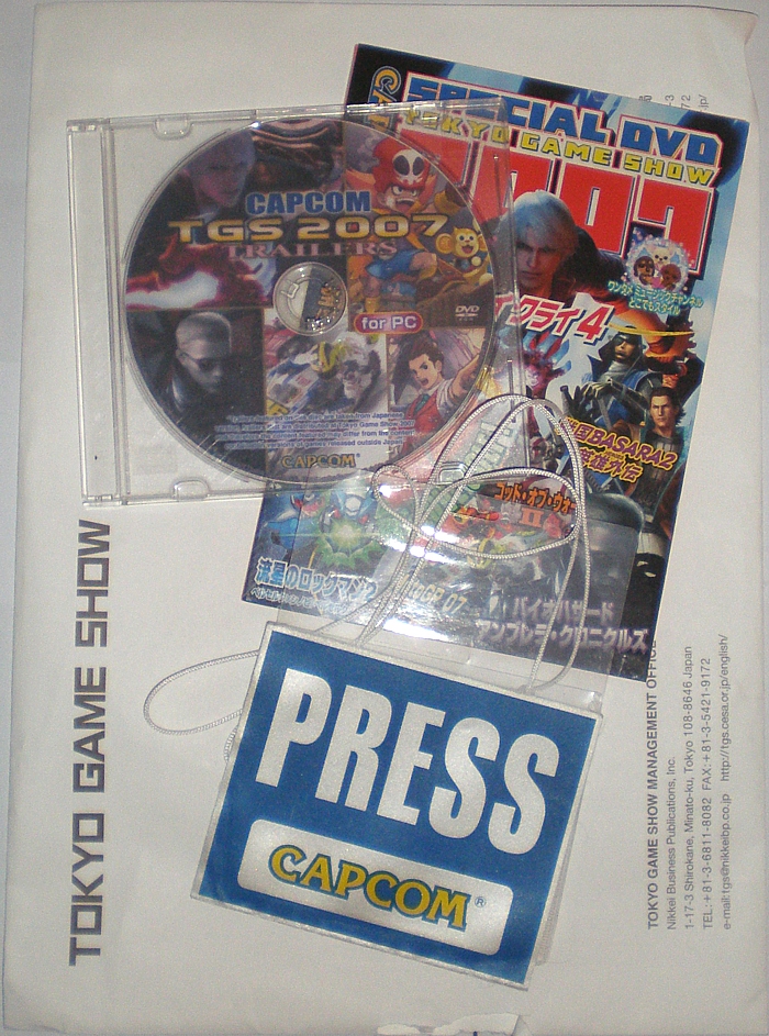 Envelope, public disc, press disc, and badge Envelope, public disc, press disc, and badge