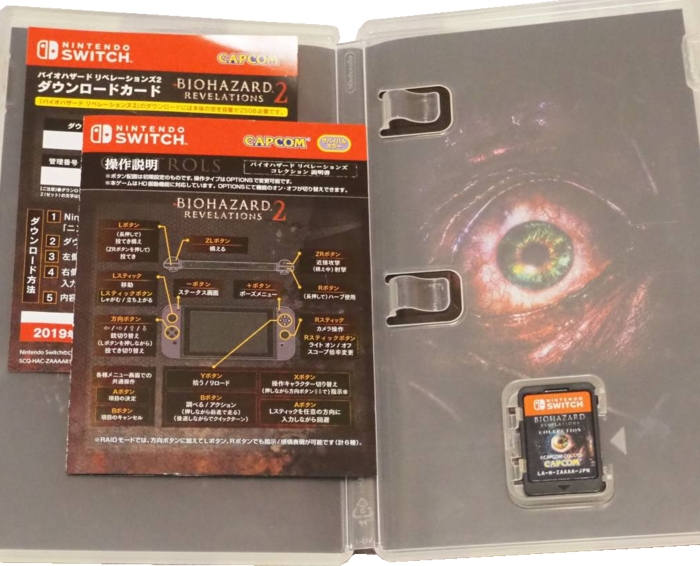 Inside of case with cartridge, manual, and DLC sheet Inside of case with cartridge, manual, and DLC sheet