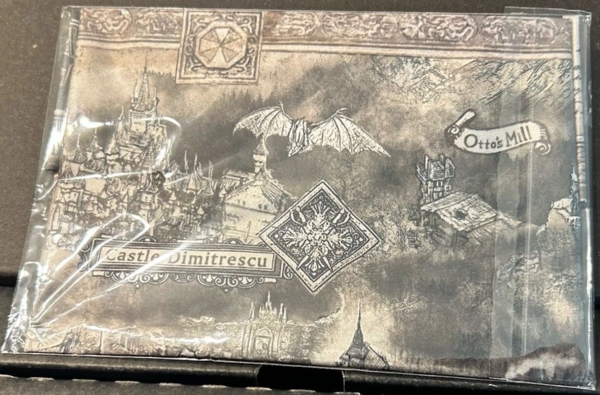 Front of folded and sealed cloth map inside box