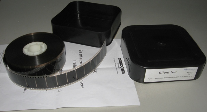 Box, reel, and note Box, reel, and note